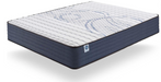 A mattress shown at an angle on a clean white background, featuring a white quilted top with blue wave-like patterns and a dark navy blue side. Winter Side