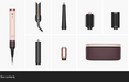 A set of hair styling tools and attachments displayed on a white background, including a wand-style iron, several curling and straightening attachments, a small loop tool, and a rectangular case. The products are arranged in a grid with a black banner at the bottom labeled 'Box contents'.
