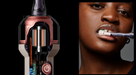 A Dyson cordless hair dryer shown in a cutaway view on the left, revealing internal components, and a close-up of a woman holding the hair dryer in her mouth on the right against a dark gray background.