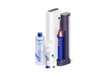 Dyson oral care product set on a white background, including an electric toothbrush with a charging dock, a bottle of oral irrigator cleaner, a tube of toothpaste, and replacement heads.